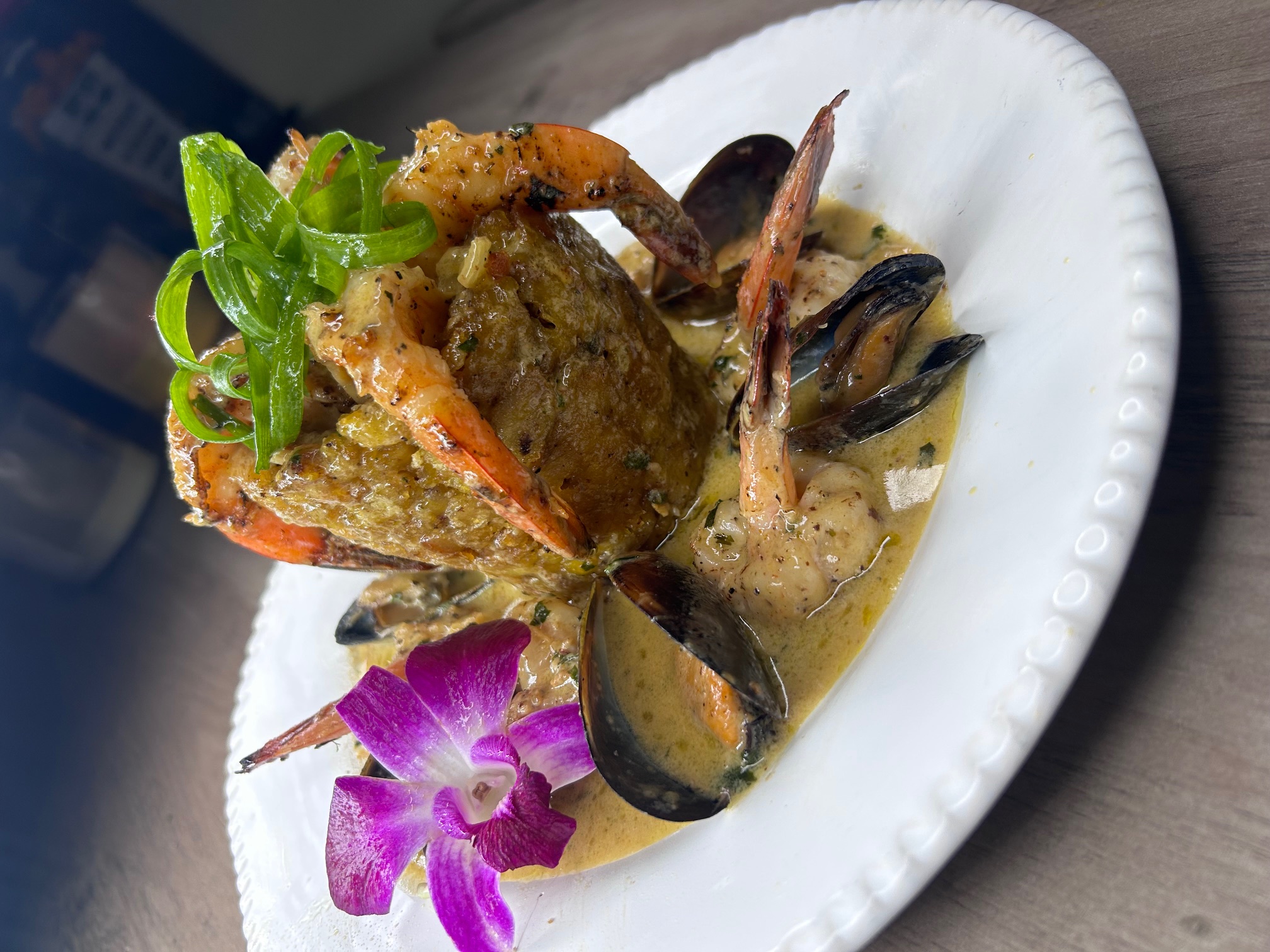 Shrimp mofongo with sautéed shrimp, mussels, and a fried plantain mound